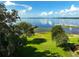 Breathtaking lake view featuring a sprawling green lawn and serene waters with boat docks at 6100 Alligator Lake W Shr, St Cloud, FL 34771