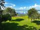 Picturesque lake view showcasing a lush lawn and tranquil waters, enhanced by two boat docks at 6100 Alligator Lake W Shr, St Cloud, FL 34771