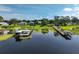 Scenic lake view featuring waterfront homes with docks and lush green surroundings, highlighting peaceful lake living at 6100 Alligator Lake W Shr, St Cloud, FL 34771