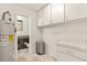 Laundry room featuring an entrance to a powder room, washer, dryer and utility sink at 6100 Alligator Lake W Shr, St Cloud, FL 34771