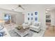 Bright living room with wood floors, sliding glass doors, and comfortable seating with accent pillows and decor at 6100 Alligator Lake W Shr, St Cloud, FL 34771