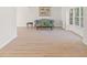 Spacious living room with wood floors, a bay window, a comfortable sofa, and elegant decor at 6100 Alligator Lake W Shr, St Cloud, FL 34771