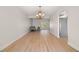 Open living room featuring new floors and a large bay window at 6100 Alligator Lake W Shr, St Cloud, FL 34771