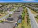 Aerial shot of the community, highlighting the residential area and surrounding properties with solar panels at 688 Cordoba Dr, Davenport, FL 33837