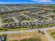 High aerial view of a residential neighborhood showcasing well-maintained homes and green spaces at 688 Cordoba Dr, Davenport, FL 33837