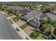 Aerial view of the property with brick driveway, well-manicured lawns, and beautiful landscaping in a residential neighborhood at 688 Cordoba Dr, Davenport, FL 33837