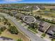 Aerial view of the neighborhood, showcasing the property with a well-maintained roof and surrounding homes at 688 Cordoba Dr, Davenport, FL 33837