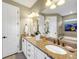 Elegant bathroom with double vanity, granite countertops, and stylish fixtures at 688 Cordoba Dr, Davenport, FL 33837