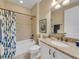 Well-maintained bathroom featuring a tiled shower/tub, granite countertop vanity, and neutral color scheme at 688 Cordoba Dr, Davenport, FL 33837