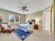 Comfortable bedroom featuring a large window, ceiling fan, and inviting decor at 688 Cordoba Dr, Davenport, FL 33837