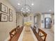 Elegant dining room with contemporary chandelier and easy access to kitchen at 688 Cordoba Dr, Davenport, FL 33837