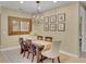 Inviting dining room with large mirror, modern chandelier, and stylish decor at 688 Cordoba Dr, Davenport, FL 33837