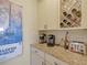 Modern kitchen with granite countertops, wine rack, stainless steel appliances, and ample counter space at 688 Cordoba Dr, Davenport, FL 33837