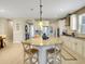 Spacious kitchen island with bar seating, granite countertops, and ample storage space at 688 Cordoba Dr, Davenport, FL 33837