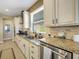Bright and functional kitchen with stainless steel appliances, granite counters, and classic cabinetry at 688 Cordoba Dr, Davenport, FL 33837