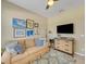 Comfortable living room featuring a sofa, TV, and decorative artwork on the walls at 688 Cordoba Dr, Davenport, FL 33837