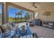 Screened-in patio featuring comfortable seating and a grill, perfect for outdoor entertaining and enjoying the beautiful weather at 688 Cordoba Dr, Davenport, FL 33837