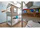 bedroom featuring custom bunk beds and beach themed decor at 8401 Secret Key Cv, Kissimmee, FL 34747