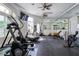 Well-equipped fitness center with treadmills, weights, and a mirrored wall at 8401 Secret Key Cv, Kissimmee, FL 34747