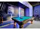 Game room featuring a pool table, unique space-themed design, and comfortable seating, creating an entertaining atmosphere at 8401 Secret Key Cv, Kissimmee, FL 34747