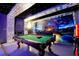 Spacious game room with a pool table, comfy couches, starry ceiling, and themed design, perfect for entertaining and relaxation at 8401 Secret Key Cv, Kissimmee, FL 34747