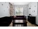 Cozy living room with plush seating, distinctive décor, and natural light invites relaxation and social gatherings at 8401 Secret Key Cv, Kissimmee, FL 34747