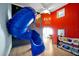 Fun playroom with a custom-built slide and toy barn-themed decor that will keep entertained for hours at 8401 Secret Key Cv, Kissimmee, FL 34747