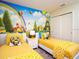 Fun ' bedroom with two twin beds and a colorful Minions mural at 8936 Sydney Ave, Kissimmee, FL 34747