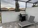 Private fenced patio area with grill and lounge chair at 8936 Sydney Ave, Kissimmee, FL 34747