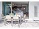Outdoor patio featuring dining set looking into home with tile flooring and lots of natural light at 8936 Sydney Ave, Kissimmee, FL 34747