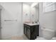 Well-lit bathroom features a single vanity, with marble floors and a toilet at 978 Splash Shot Pl, Davenport, FL 33896
