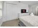 Comfortable bedroom featuring soft carpet, ample storage, and an inviting atmosphere at 978 Splash Shot Pl, Davenport, FL 33896