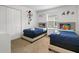 Bright ' bedroom with twin beds, playful decor, and closet at 978 Splash Shot Pl, Davenport, FL 33896