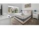 Cozy bedroom with a large window, providing ample natural light and a comfortable retreat at 978 Splash Shot Pl, Davenport, FL 33896