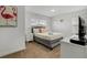 Bright bedroom with neutral tones, plush bedding, and soft lighting creating a peaceful atmosphere at 978 Splash Shot Pl, Davenport, FL 33896