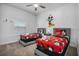 Whimsical bedroom with twin beds, featuring vibrant decor and a playful Mickey Mouse theme at 978 Splash Shot Pl, Davenport, FL 33896