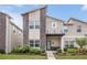 Charming two-story home with stone accents, inviting entrance, and well-maintained landscaping, offering curb appeal at 978 Splash Shot Pl, Davenport, FL 33896