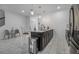Open kitchen featuring marbled tile floors, kitchen island, stainless steel appliances, and pendant lighting at 978 Splash Shot Pl, Davenport, FL 33896