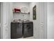 Laundry room with front loading washer and dryer with white walls at 978 Splash Shot Pl, Davenport, FL 33896