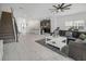 Open concept living space with stairs, kitchen, living room, and dining space at 978 Splash Shot Pl, Davenport, FL 33896