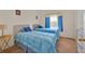 Bright bedroom with twin beds, carpet flooring, and serene atmosphere offering a comfortable living space at 1010 Prey Ct, Kissimmee, FL 34746