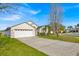 Charming single-Gathering home with a two-car garage and well-maintained landscaping on a sunny day at 1010 Prey Ct, Kissimmee, FL 34746