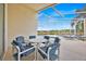 Relaxing screened patio area with table, chairs, and views of the pool and lake at 1010 Prey Ct, Kissimmee, FL 34746