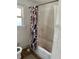 Outdated bathroom showing a tub/shower combo with old tile and a shower curtain at 1011 26Th Street, Orlando, FL 32805