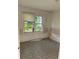 Bedroom showing window and dated floors ready for a new design at 1011 26Th Street, Orlando, FL 32805
