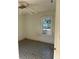 Bedroom with a ceiling fan, window and outdated floors ready for remodel at 1011 26Th Street, Orlando, FL 32805