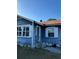 Charming single-story home featuring blue siding, white trim, and a small front porch at 1011 26Th Street, Orlando, FL 32805
