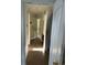 Hallway with tile floors and doorways leading to various rooms in need of refurbishment at 1011 26Th Street, Orlando, FL 32805