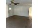 Open-plan living room with linoleum floors and a doorway to another room at 1011 26Th Street, Orlando, FL 32805