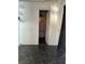 Empty room with black marble tile flooring and access to an outdoor space at 1011 26Th Street, Orlando, FL 32805